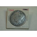 A United States Of America 1928 Silver Peace Dollar.