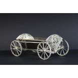Harrods silver bon bon trolley in the form of a carriage, the pierce tail pieces with foliate scroll