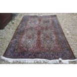 Eastern style silk Rug, the stylised pattern including foliage, 306cms x 183cms