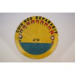 Original Lifeboat Circular Plaque from H.M.S Uganda depicting the sun with a face rising over the