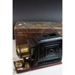 A boxed antique magic lantern.