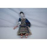 Chinese / Oriental Composition and Wooden Doll dressed in traditional embriodered clothing, 26cms