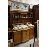 19th century Pine Dresser Base, the shaped front with three central drawers flanked by two