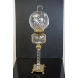 Late 19th / Early 20th century Oil Lamp, the faceted clear glass well raised on a twisted clear