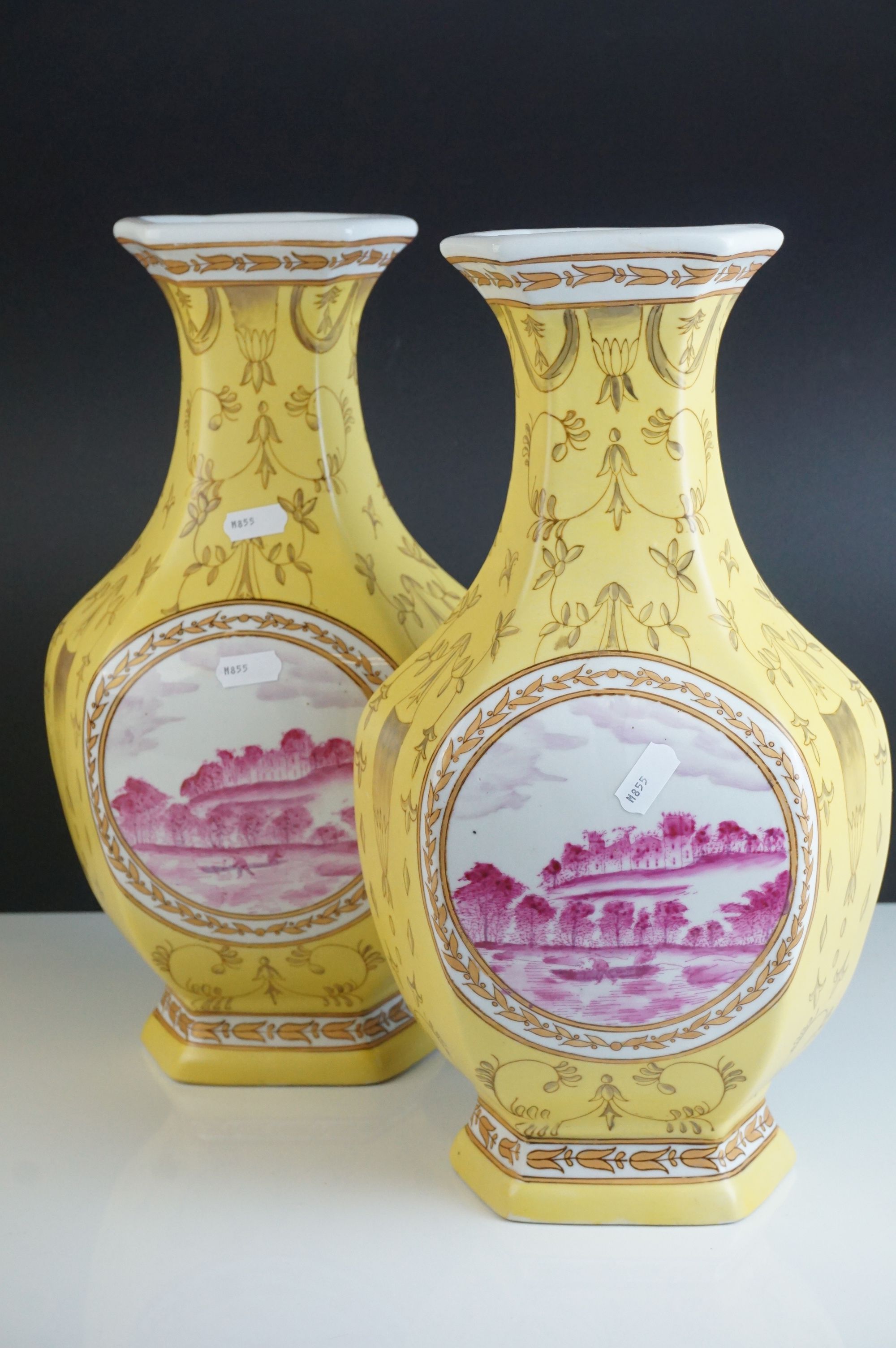 Pair of 20th century Chinese Yellow Ground Vases decorated with panels of European Landscape