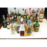 Large quantity of bottled spirits and Liqueurs to include Vodka,Port sherry Pernod Curaco sabra