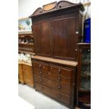 19th century Mahogany Cabinet on Chest, the upper section with two doors opening to reveal shelves