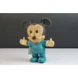 A vintage Mickey Mouse toy figure.