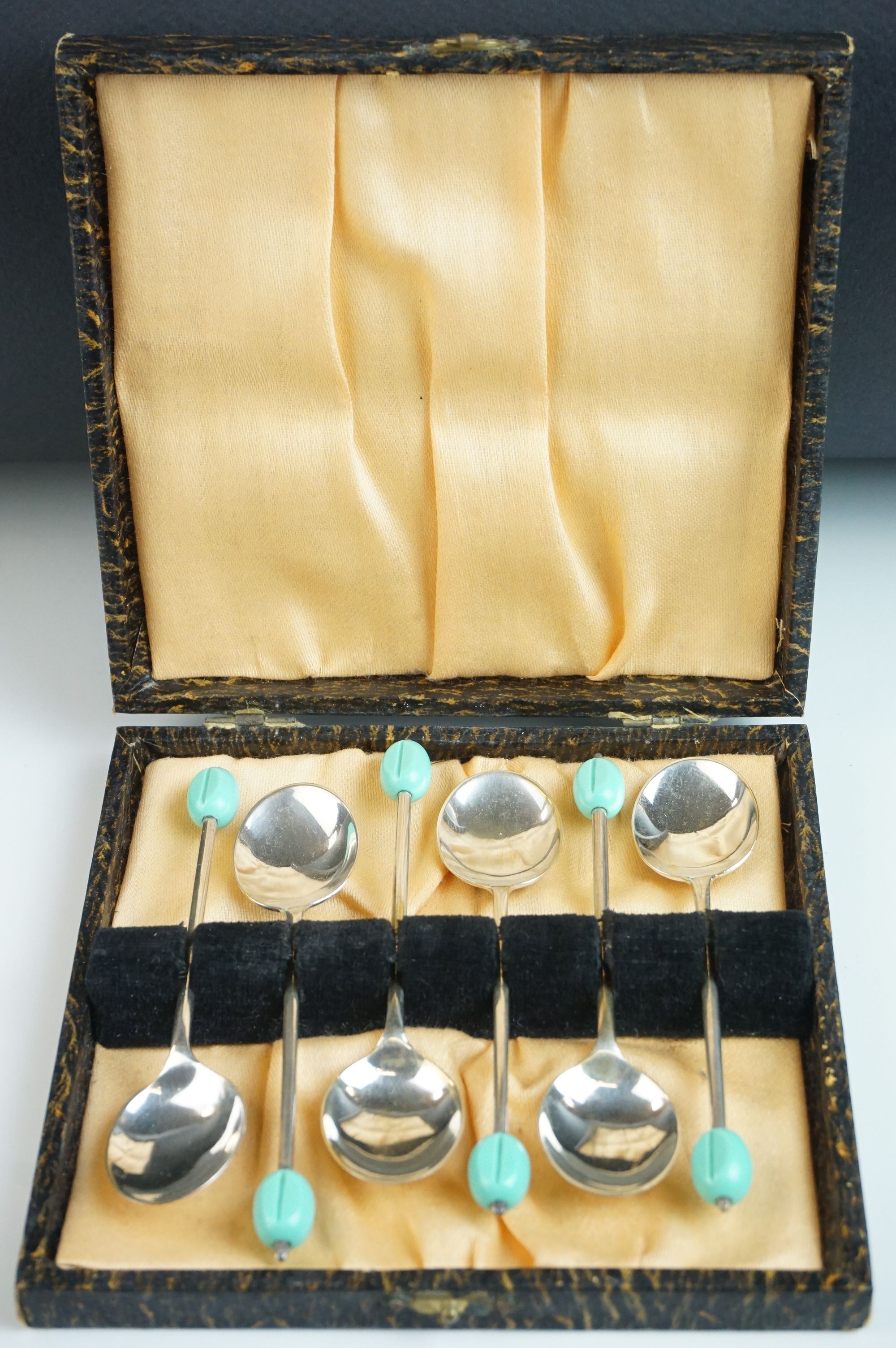 Cased set of 1930's / 40's EPNS Coffee Bean Spoons with green coffee bean terminals