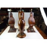 Four contemporary burr hard wood lamps of classical form.