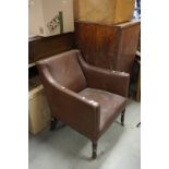 George III Brass Studded Brown Leather Library Chair raised on turned front legs with castors, 83cms