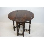 Small Antique Oak Gate-leg Oval Table, raised on barley-twist supportsand cross-stretchers, 72cms