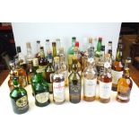 A large quantity of bottled spirits Whisky to include Bourbon opened partially consumed, Chivas