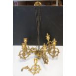 A carved wooded gilt chandelier five branch ceiling light of classical form together with spare arm.