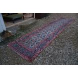 Eastern Red Ground Wool Rug with stylised floral pattern