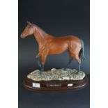 Royal Doulton model of Red Rum DA218, no. 1132, on wooden plinth with name plaque, 36cms high