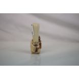 Antique Carved Ivory Figure of a Man with large Cone Head, 7cms high