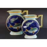 Two matching Victorian Majolica Jugs, tones of blue and green and with relief decoration of fish,