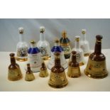 Thirteen Wade Whisky Coronation and other decanters eleven with contents.