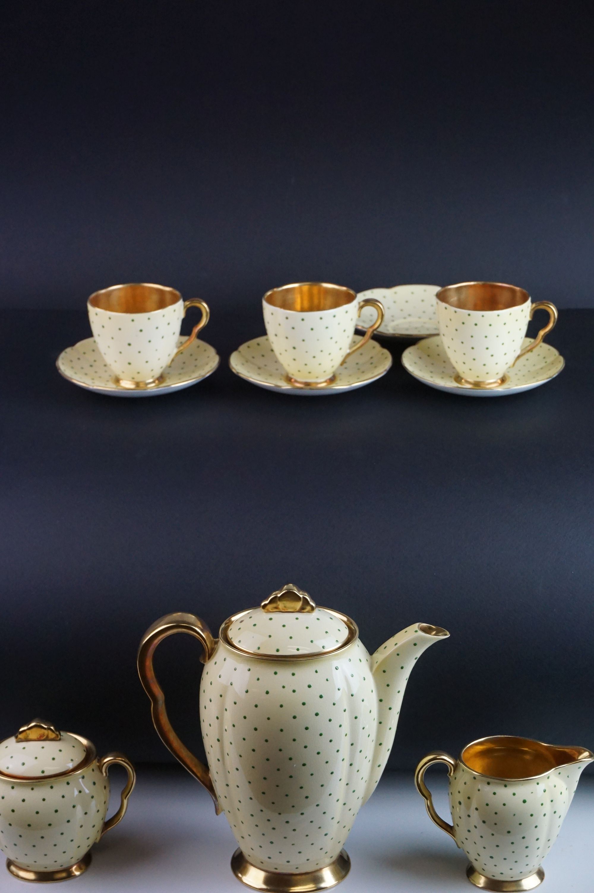 Early 20th Century Carlton ware coffee set, enamelled with green dots on a yellow ground, comprising