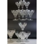 Part suite of late 19th Century wine glasses, of trumpet form with hobnail cut decoration, seven
