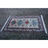 Blue and Cream Ground Rug with an Orange and Red Bukhara style pattern, 200cms x 128cms