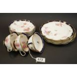 Early 20th Century George Jones part tea set, painted with pink roses within blue and gilt