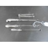 Three Silver Button Hooks and a Pair of Silver Tongs