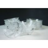 Set of eight glass step cut dessert bowls and stands