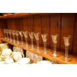 Set of twelve 18th Century style wine glasses, the funnel bows supported on facet cut stems