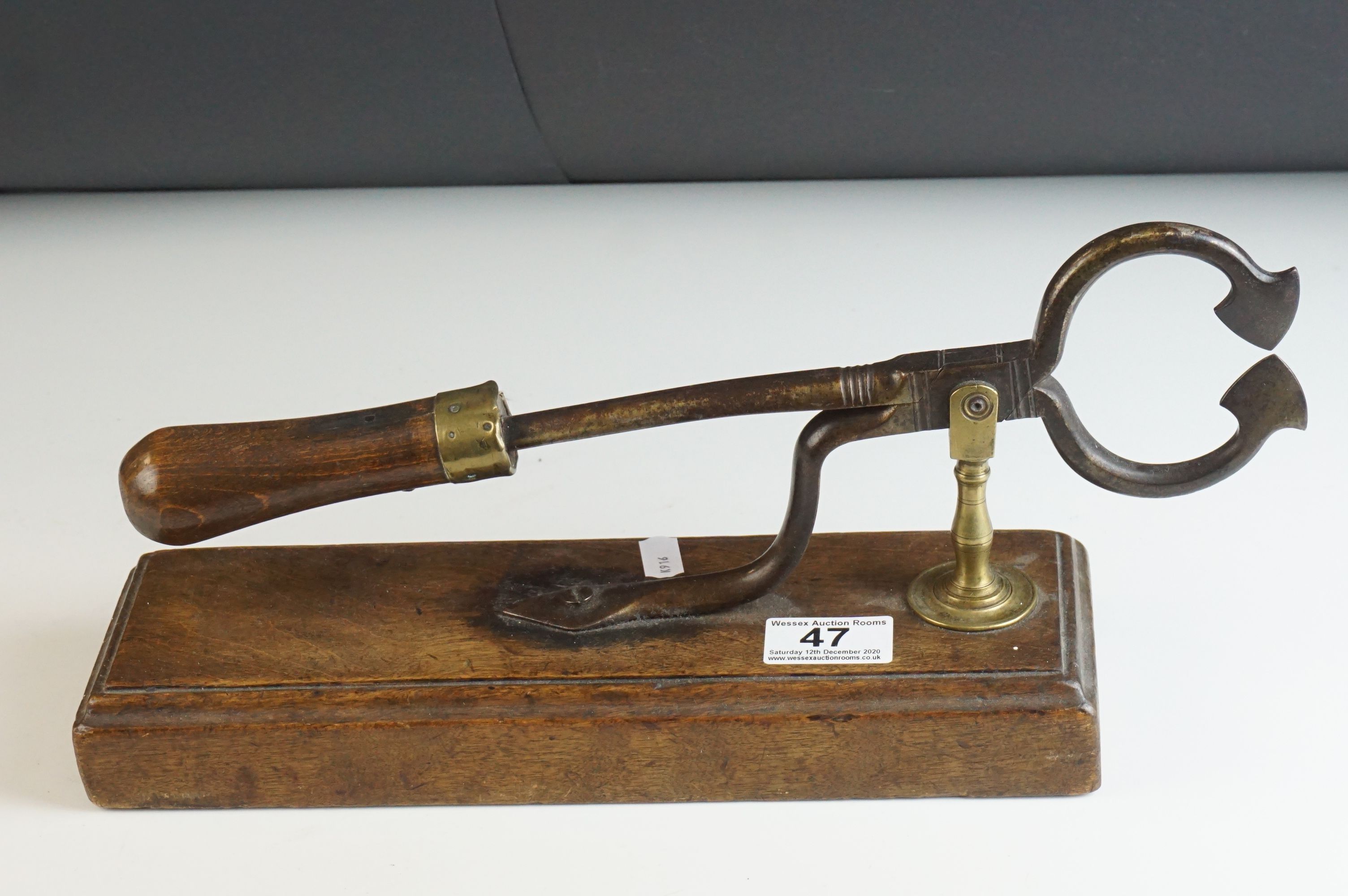 19th century Sugar Loaf Table Cutters, with turned wooden handle, brass support and mounted on a