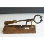 19th century Sugar Loaf Table Cutters, with turned wooden handle, brass support and mounted on a