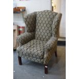 George III style Wingback Armchair, re-upholstered in a black fabric with gold leaf pattern,