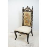 Victorian Ebonised Chair with Gilt and Mother of Pearl decoration, the back and seat with needlework