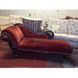 Victorian Mahogany Framed Chaise-lounge, with carved scroll back rail and raised on turned legs with