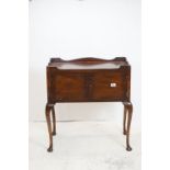 George III Style Mahogany Serving Table, the gallery top with pierced carrying handles, above a