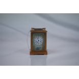Brass cased miniature Carriage Clock with porcelain panels