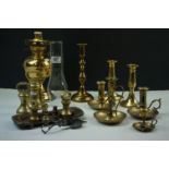 A set of antique brass bell weights together with an oil lamp, a pen tray, candle sticks etc.