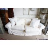 Two Seater Sofa with white removable covers and a selection of gingham and patchwork cushions,
