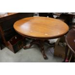 Victorian Mahogany Tilt Top Oval Centre Table / Loo Table, raised on four turned column supports