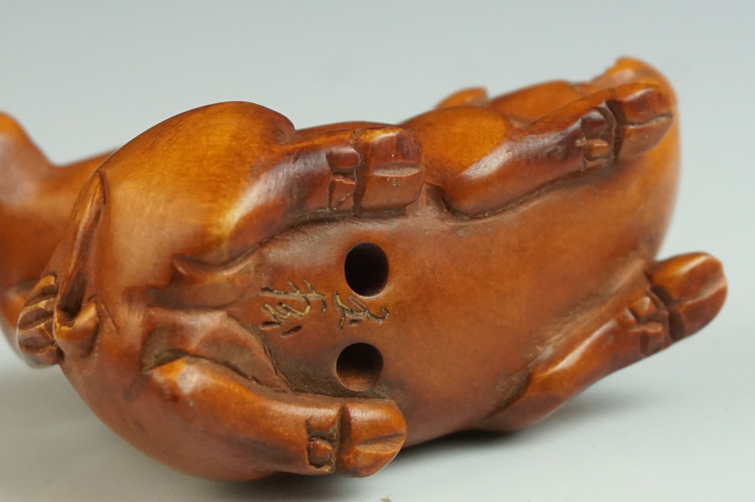 Japanese Carved Boxwood Netsuke in the form of a Monkey stood on a Pig, signed, 5cms long - Image 4 of 4