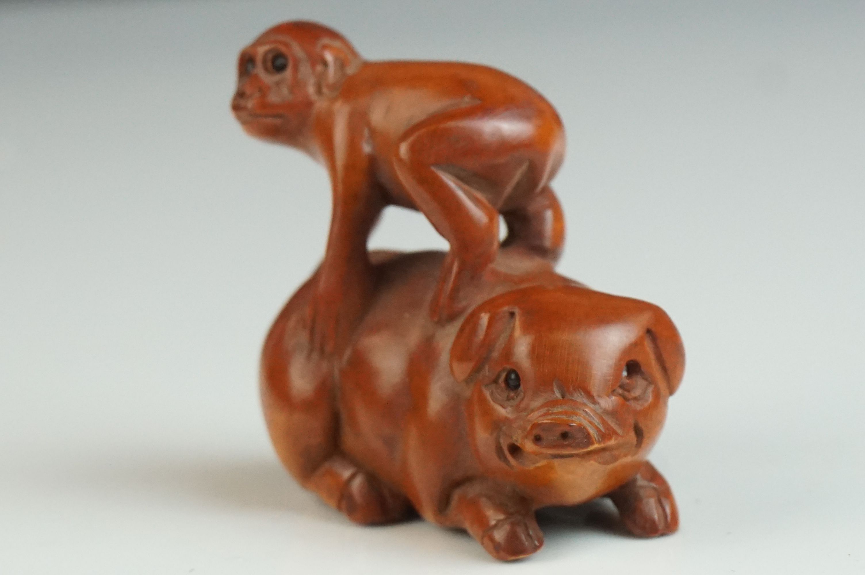 Japanese Carved Boxwood Netsuke in the form of a Monkey stood on a Pig, signed, 5cms long - Image 2 of 4