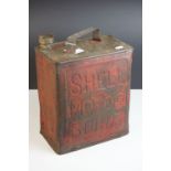 A vintage Shell Motor Spirit petrol can with Esso cap.