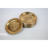 Set of Eleven Brass Small Circular Dishes, all with different embossed Railway and Steam