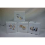 Collection of Four Swarovski Crystal Memories Clocks, gold, in original boxes