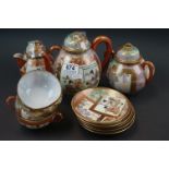 Japanese egg shell tea set, painted with panels of bijin or wisteria, comprising: a tea pot and