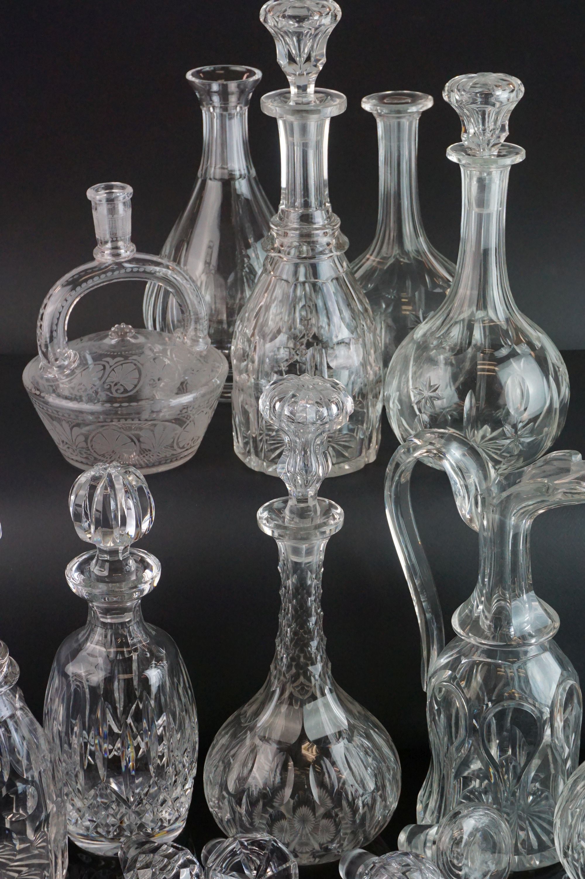 Collection of Nine Decanters and a Claret Jug, some with matched stoppers, together with a