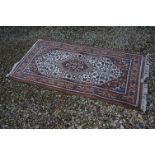Brown, Blue and Cream Ground Wool Rugs with stylised design, 173cms x 88cms