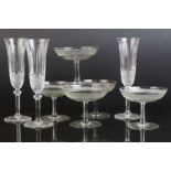 Twelve 20th Century glass champagne flutes, and nine similar larger, plus Six futher champagne