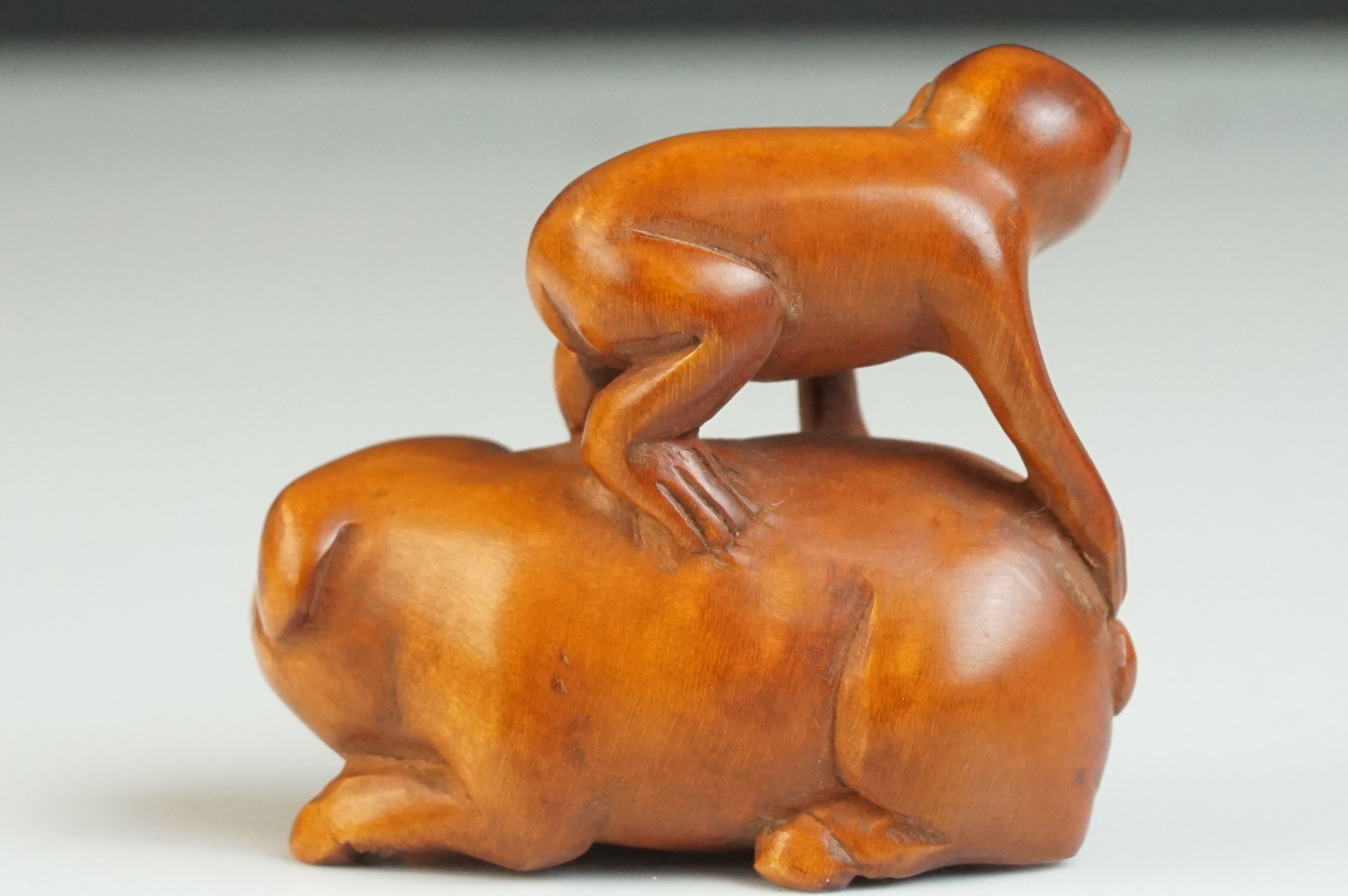 Japanese Carved Boxwood Netsuke in the form of a Monkey stood on a Pig, signed, 5cms long - Image 3 of 4